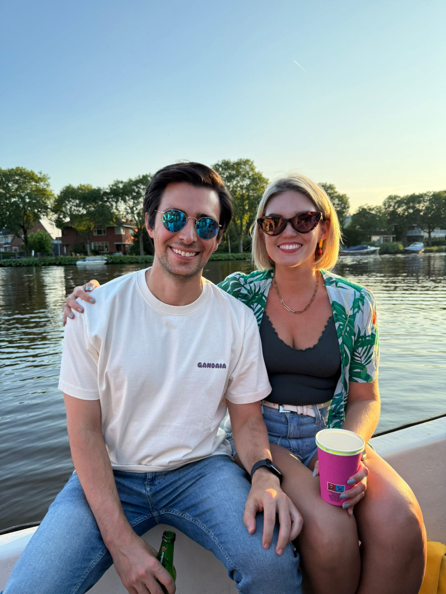 Nina and Javi on a boat at golden hour